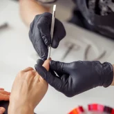 nail-technician-doing-manicure-to-client-in-salon-2025-03-13-12-41-07-utc nail-technician-doing-manicure-to-client-in-salon-2025-03-13-12-41-07-utc